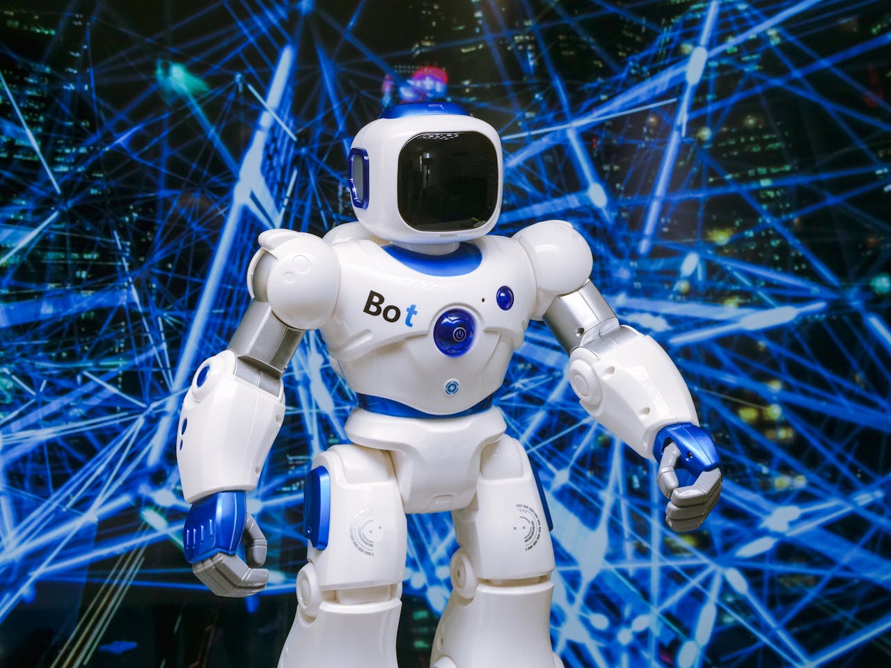 gallery-2 Advanced humanoid robot with glowing blue accents in a digital network setting.